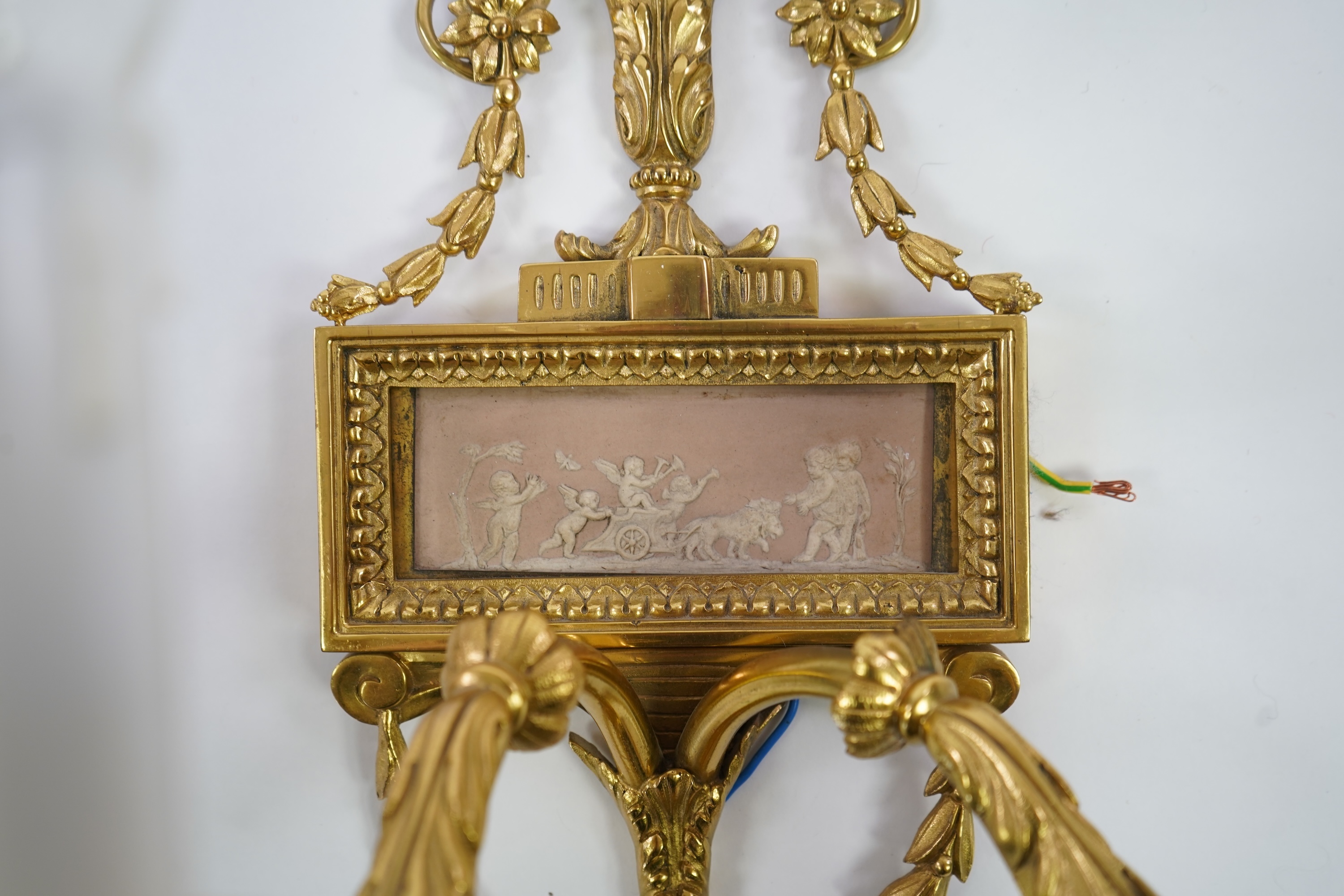 A set of four Adam style ormolu and jasper ware mounted wall appliques, early 20th century